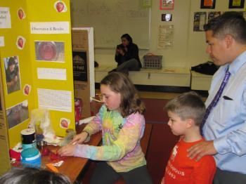 parent and kids doing crafts 